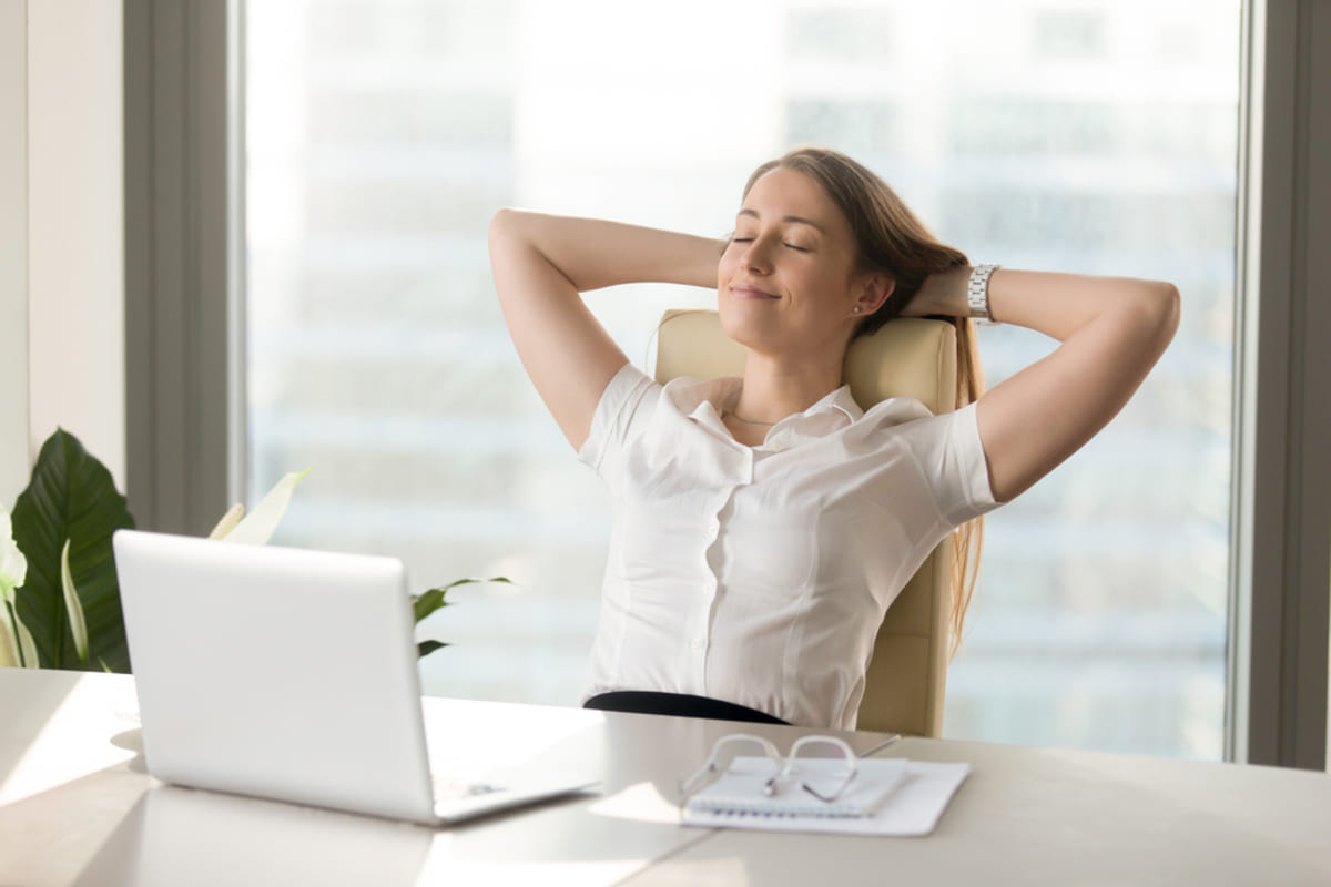 Relaxed woman sitting back in a chair
