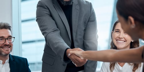 Two professionals shaking hands