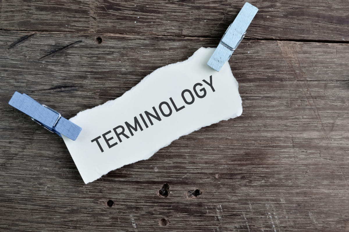 White paper written with text terminology on a wooden background, understanding lease agreement for commercial property