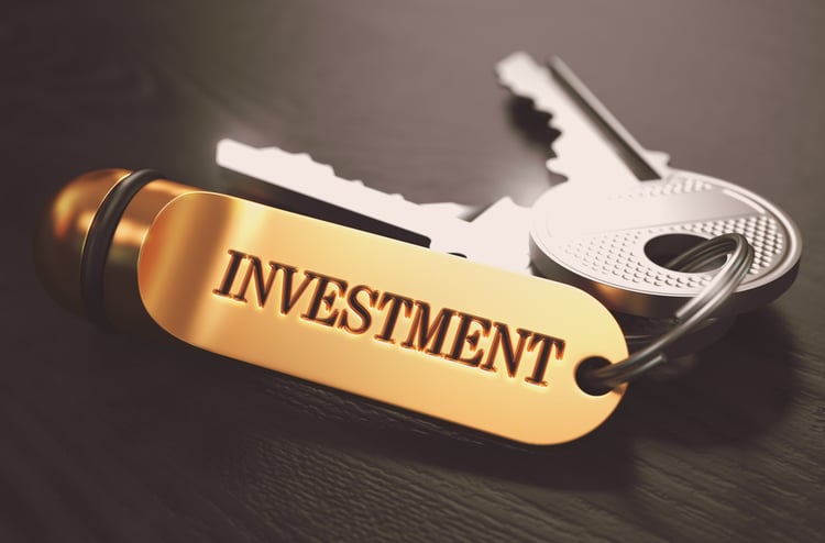 Keys with Word Investment on Golden Label, REIT vs. syndication concept. 