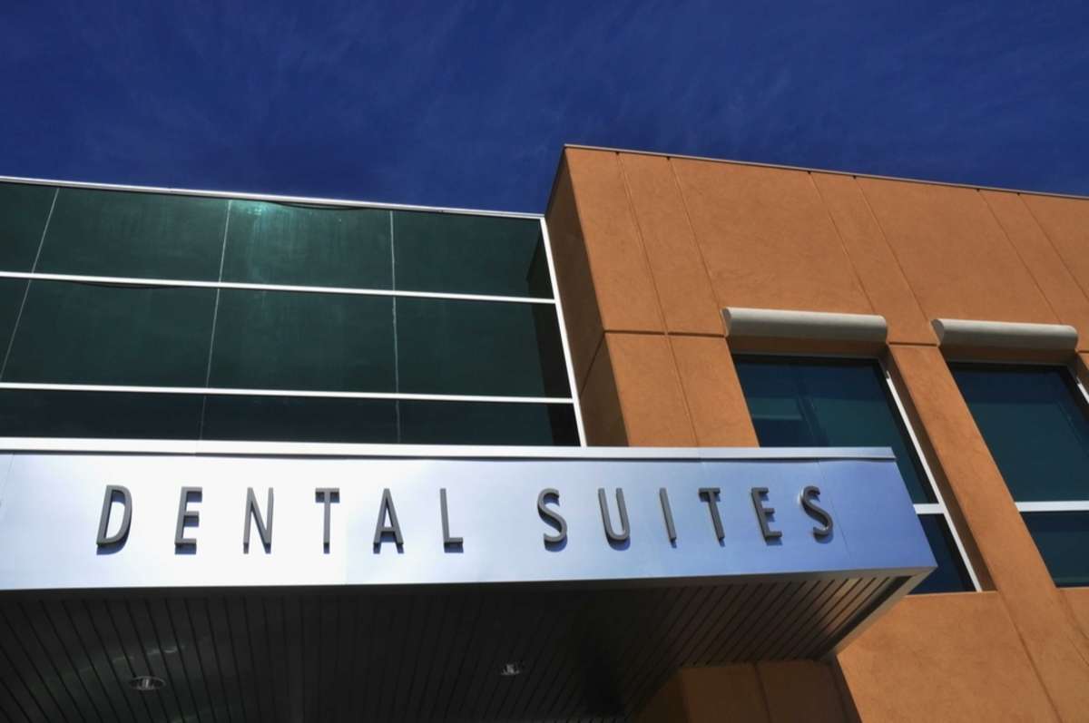 A sign on a building advertising dental suites is an example of multi-tenant real estate