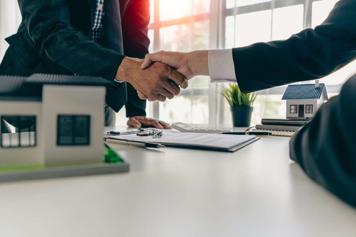 Business people shake hands to rent a space for business