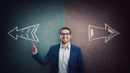 Confident businessman pointing forefinger choosing the correct direction