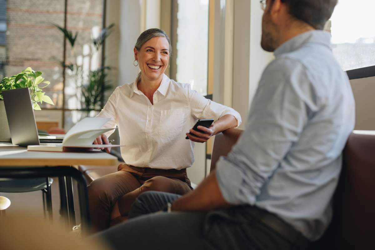 Woman talking with a man about the best commercial real estate Baltimore offers