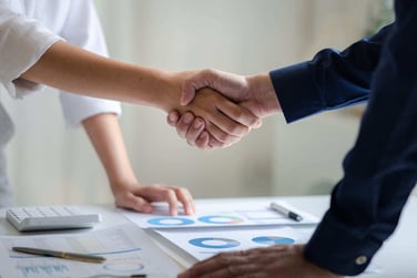 Two professionals shaking hands.
