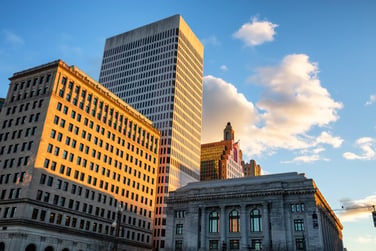 This image of office buildings represents commercial real estate investing strategy. 