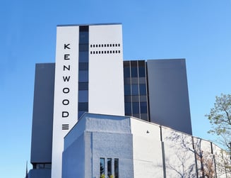 Businesswoman talking to client over tablet