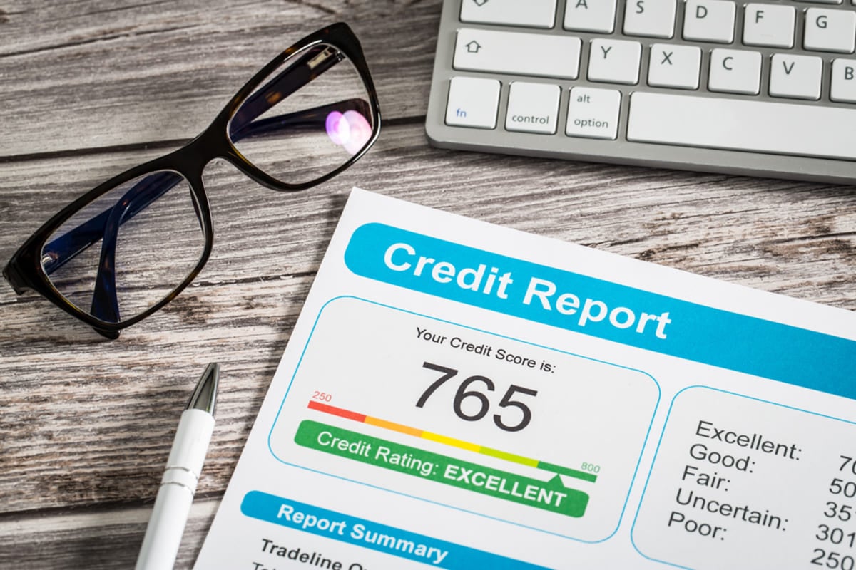 A credit report on a table, what financial information can a landlord ask for concept