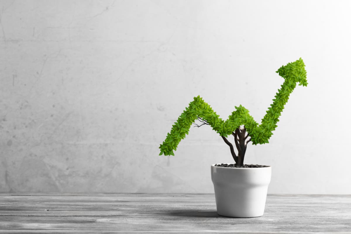 An arrow showing profitability growth, Kenwood Management's property management strategies concept