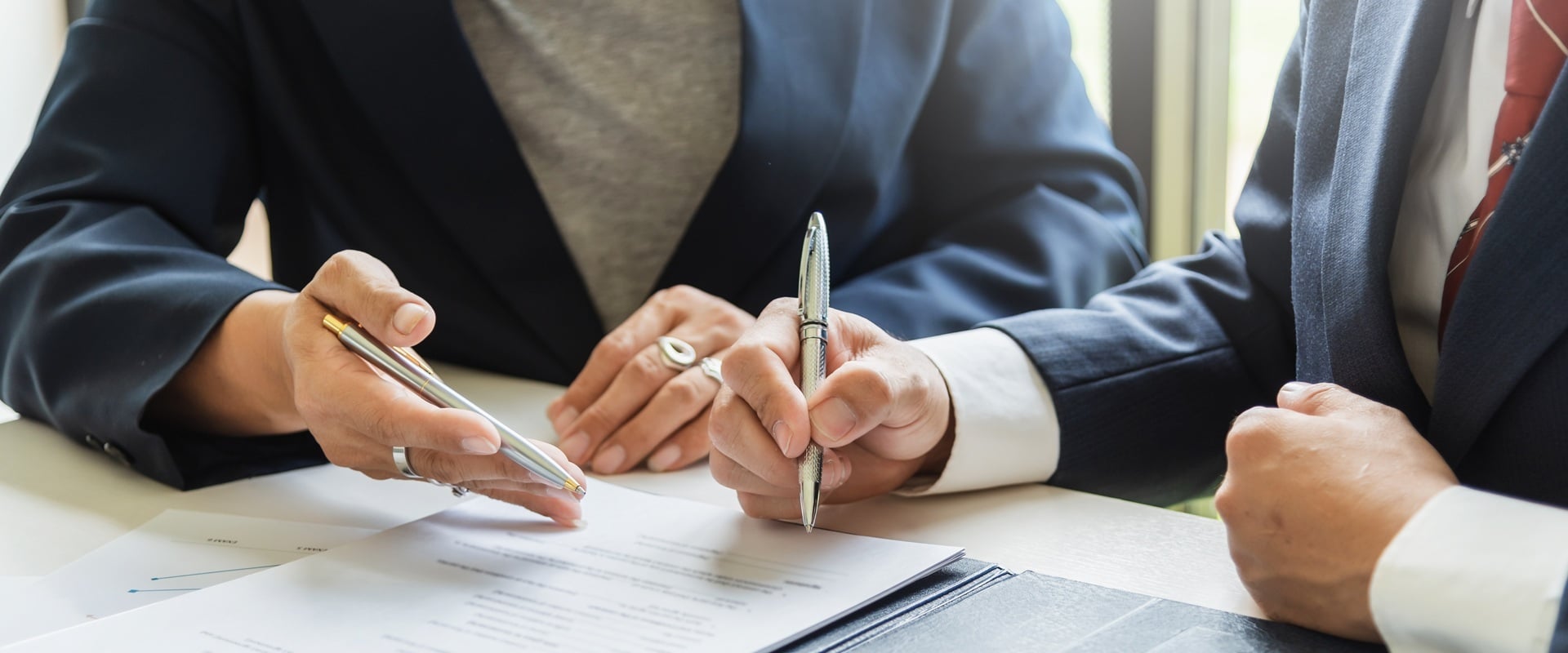 Business People Signing an Agreement