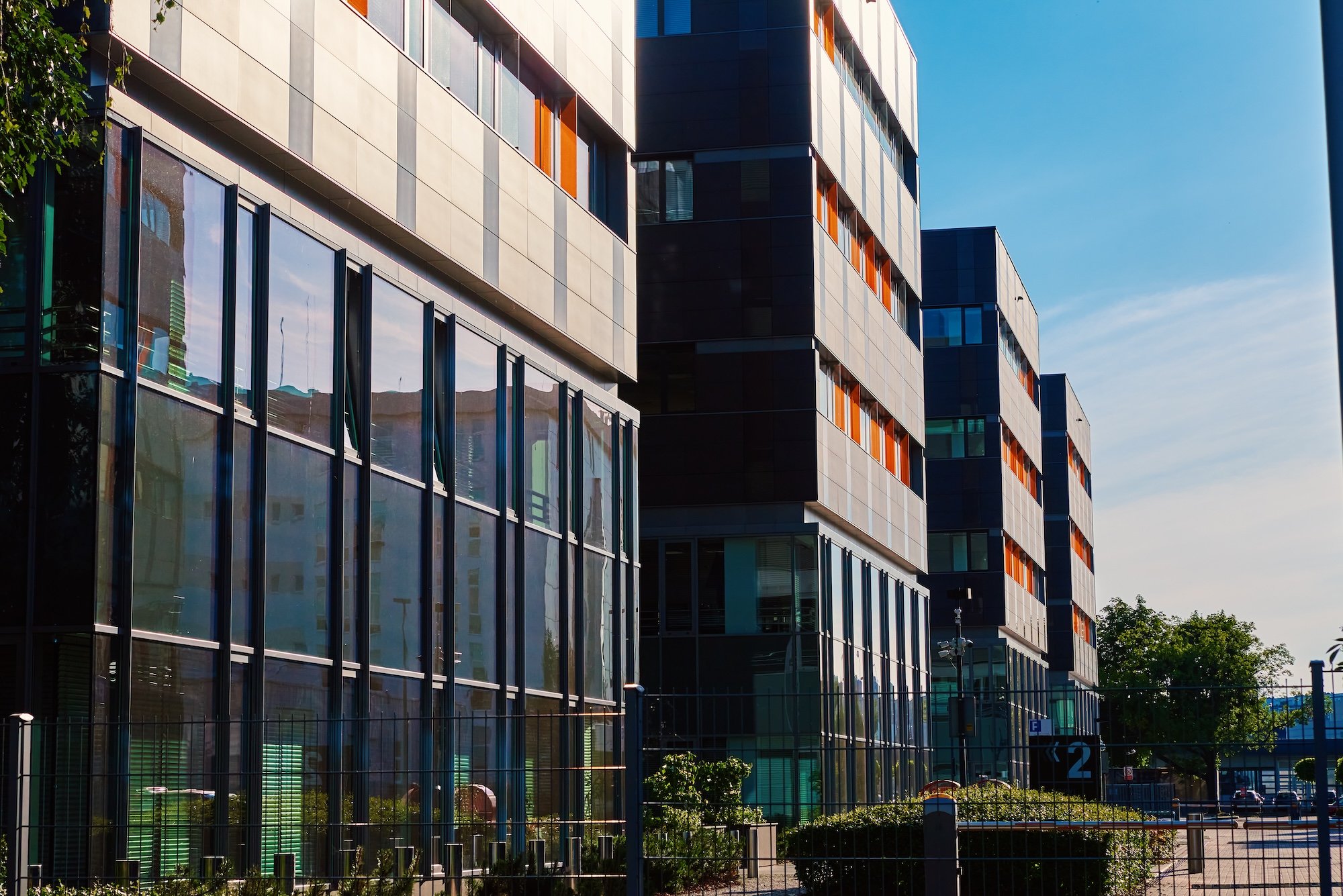 This image features the exterior of a commercial real estate office building. 