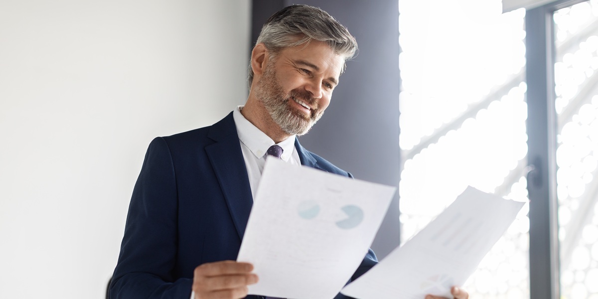 Investment partner reviewing financial reports