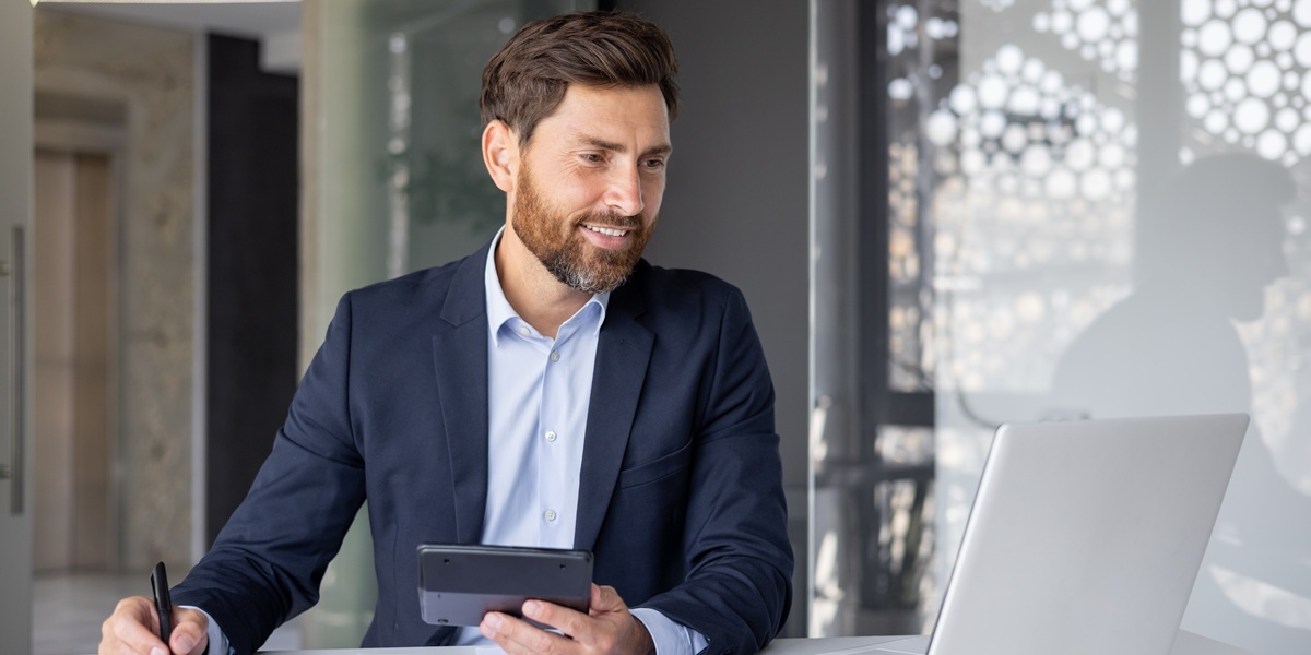 Male accountant reviewing financial statements