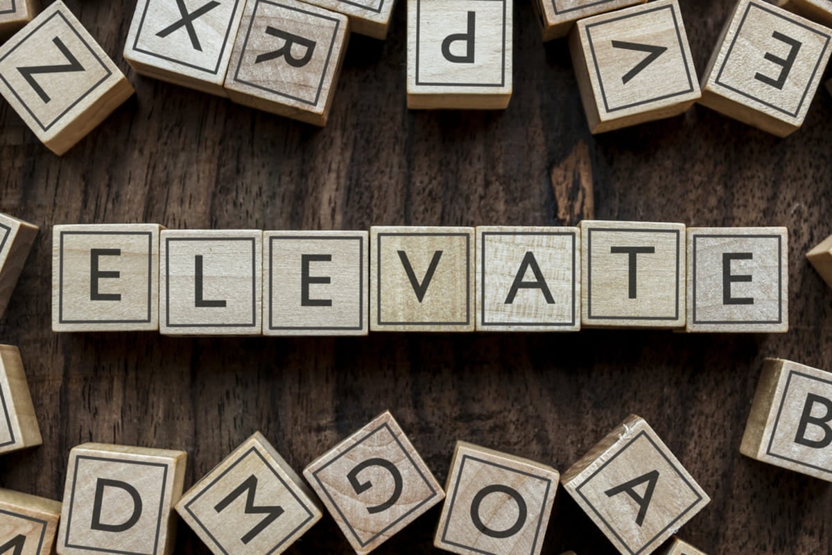 The word Elevate spelled in blocks, Kenwood's approach to Baltimore property management services concept