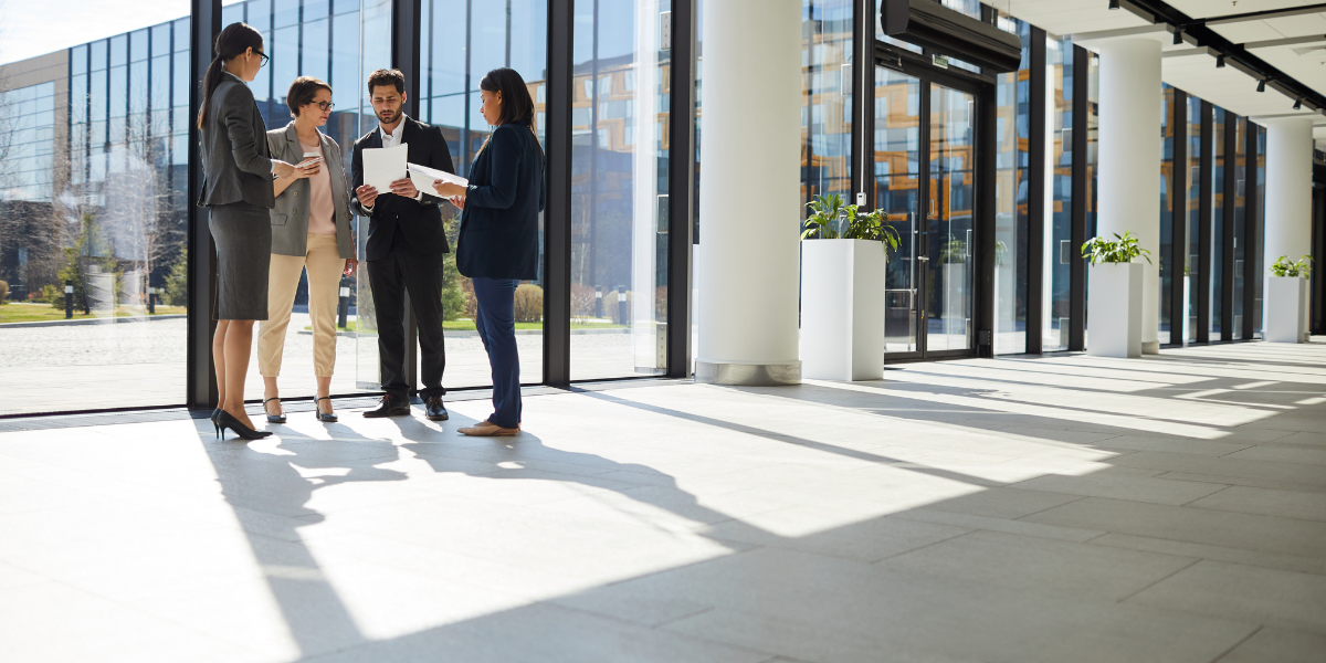 02 Business Professionals Collaborating in Modern Office Building