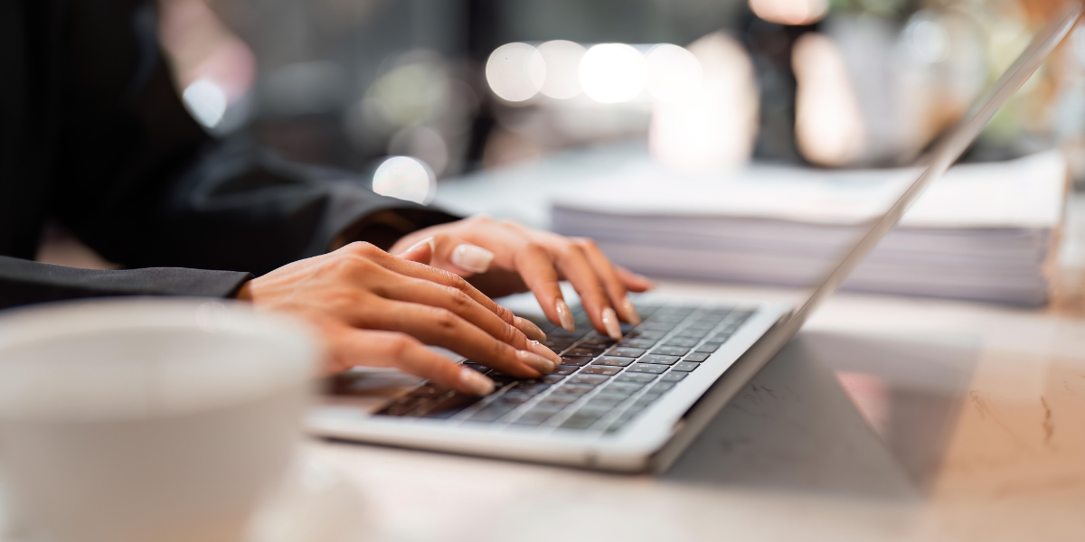 07 Professional Typing on Laptop