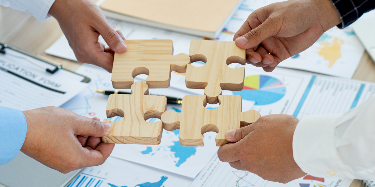 08 Teamwork Concept with Puzzle Pieces in the Workplace