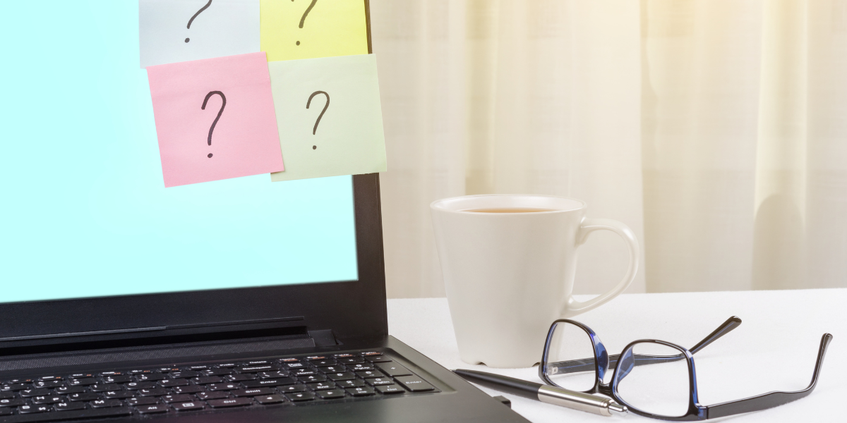 09 Office Setup with Laptop and Question Marks