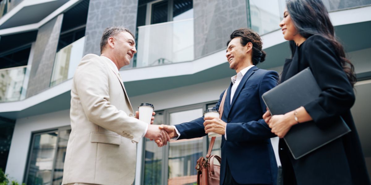03 Business Handshake Near Modern Office Building