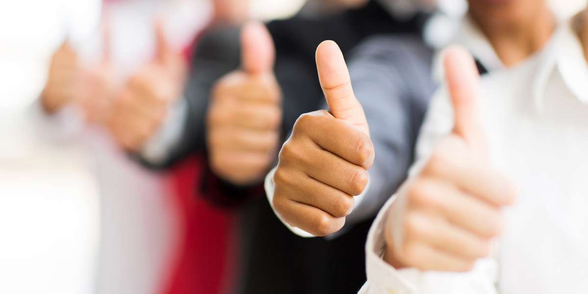 Closeup portrait of business people giving thumbs up