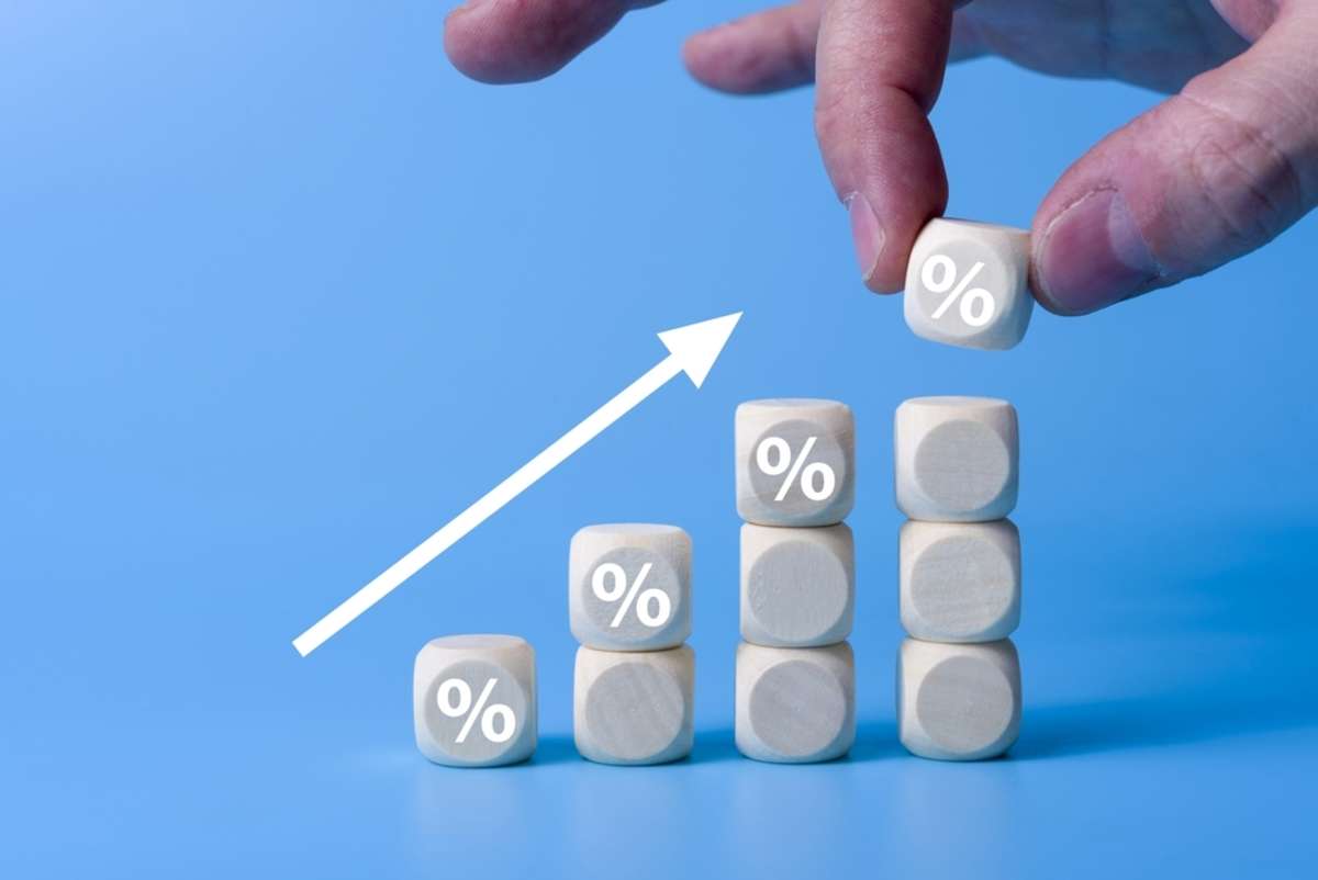 Wooden blocks with percentage sign,represent in meanings of interest rate increase