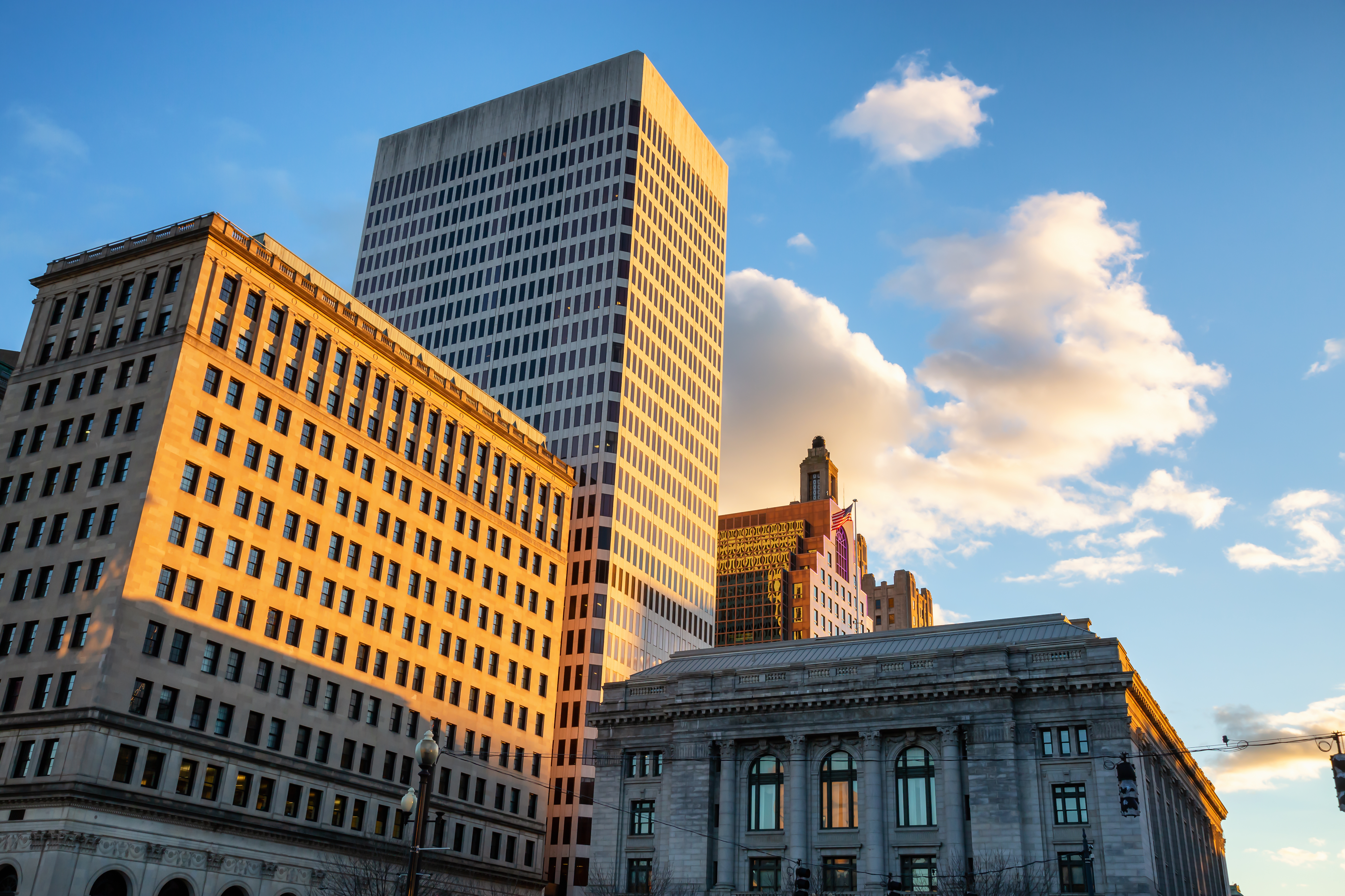 This image of office buildings represents commercial real estate investing strategy. 