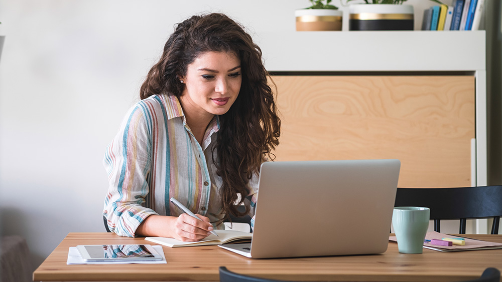 Woman searching on laptop